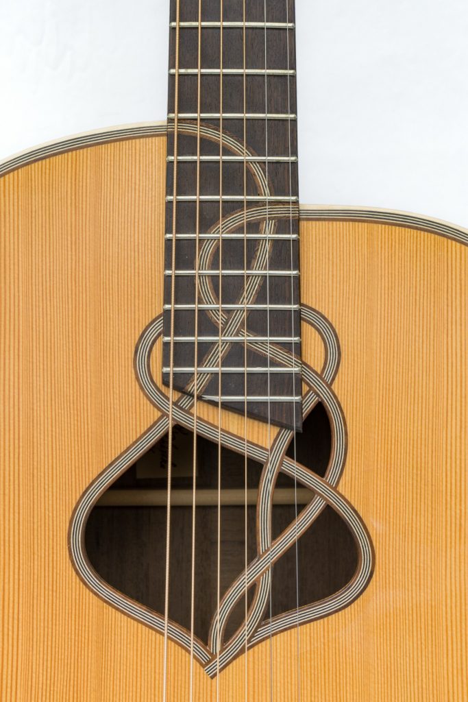 https://www.customguitarneckinlays.com/